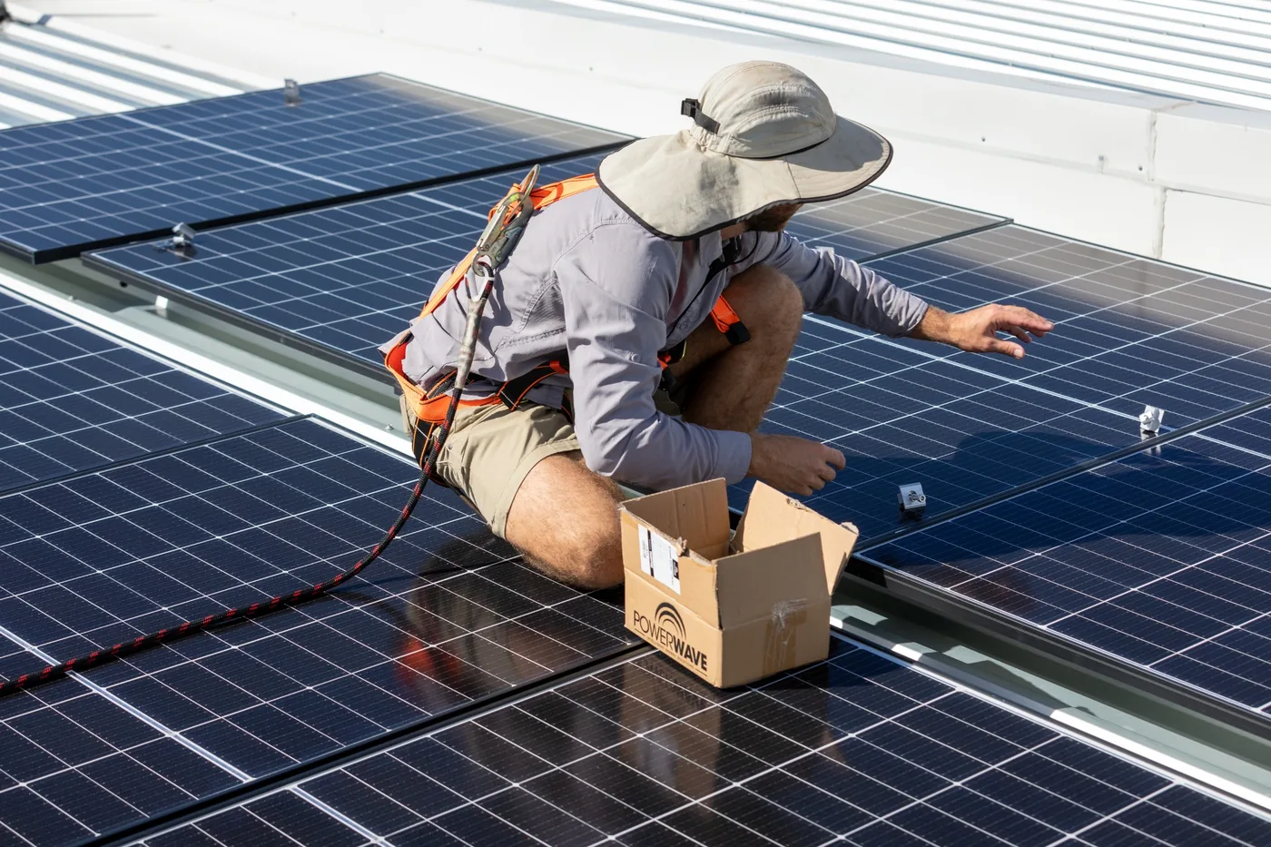 Stored Power installer completing a professional solar panel installation on the Gold Coast