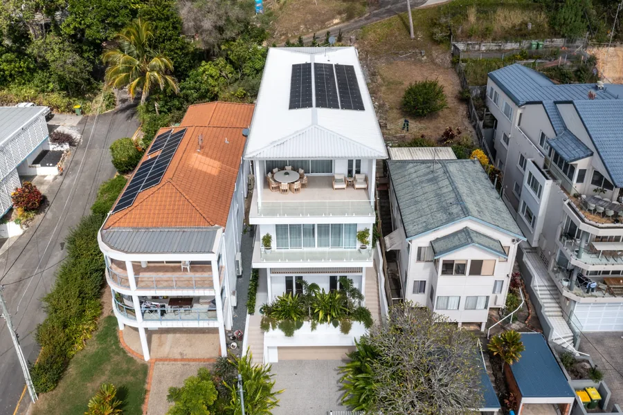 Aerial view of residential solar panels installed on neighbouring Gold Coast homes